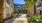 Courtyard Walkway with Bench and Palm Trees